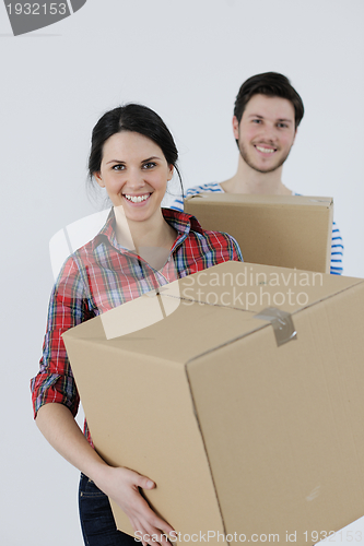 Image of Young couple moving in new home