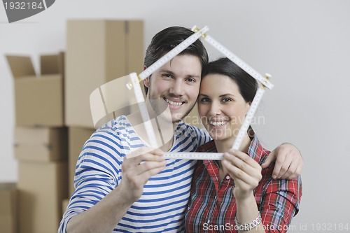 Image of Young couple moving in new home