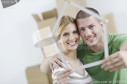 Image of Young couple moving in new home