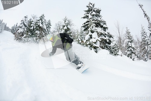 Image of snowboarder on fresh deep snow