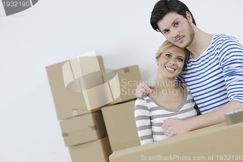 Image of Young couple moving in new home