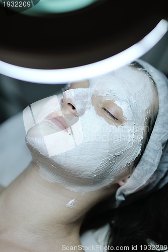 Image of woman with facial mask in cosmetic studio