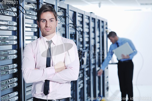 Image of it enineers in network server room