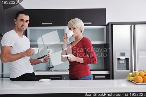 Image of young couple have fun in modern kitchen