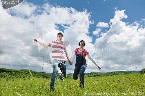 Image of romantic young couple in love together outdoor