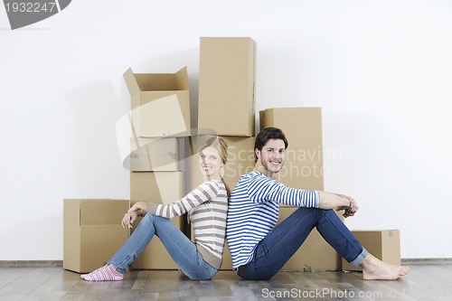 Image of Young couple moving in new home