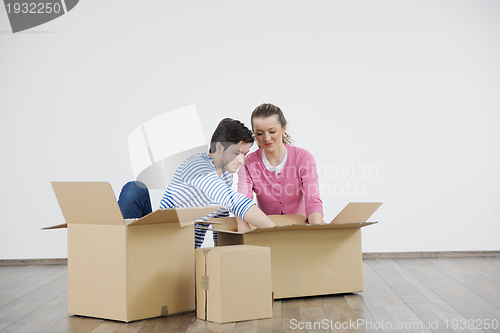 Image of Young couple moving in new house