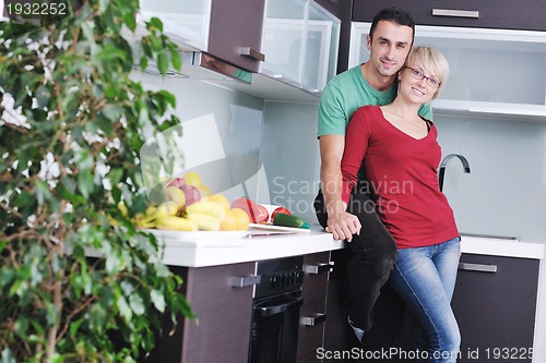 Image of young couple have fun in modern kitchen