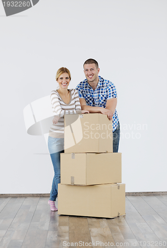 Image of Young couple moving in new home