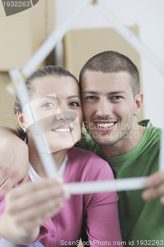 Image of Young couple moving in new home