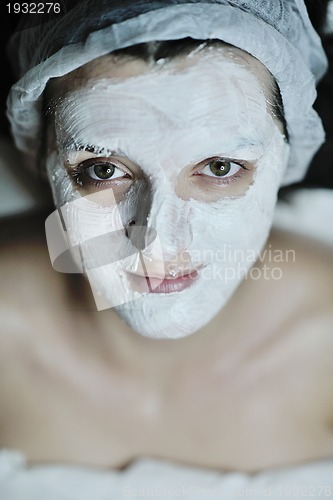 Image of woman with facial mask in cosmetic studio