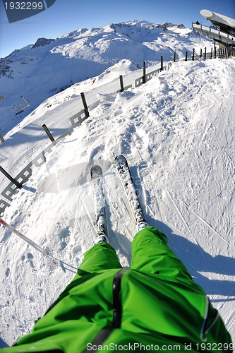Image of skiing on fresh snow at winter season at beautiful sunny day