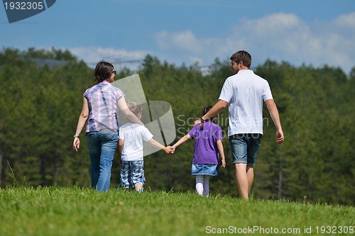 Image of happy young family have fun outdoors
