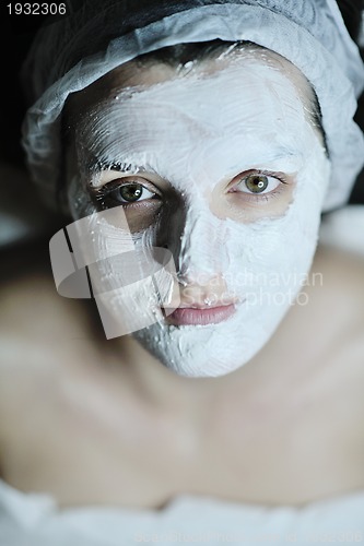 Image of woman with facial mask in cosmetic studio
