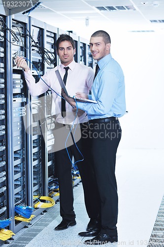 Image of it enineers in network server room