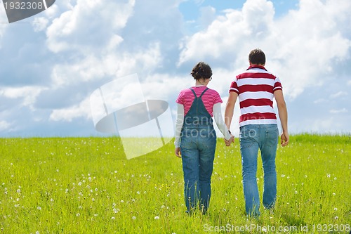 Image of romantic young couple in love together outdoor