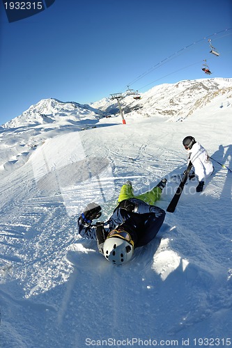 Image of skiing on fresh snow at winter season at beautiful sunny day