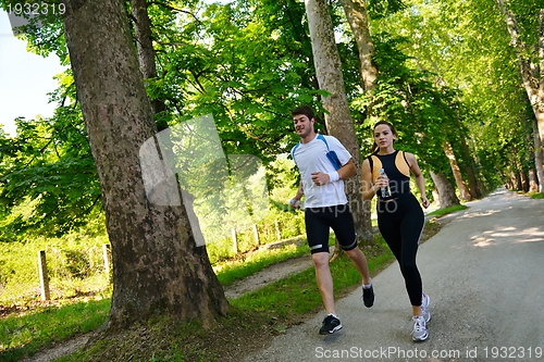 Image of Young couple jogging