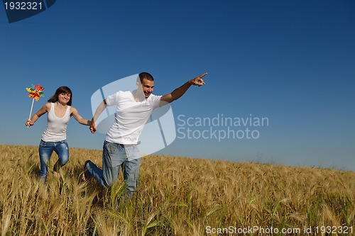 Image of happy couple in wheat field