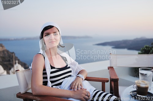 Image of Greek woman on the streets of Oia, Santorini, Greece