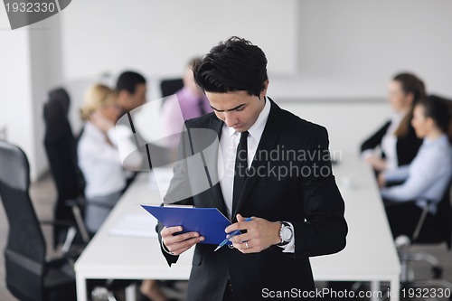 Image of young business man at meeting