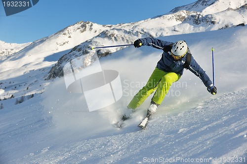 Image of skiing on fresh snow at winter season at beautiful sunny day