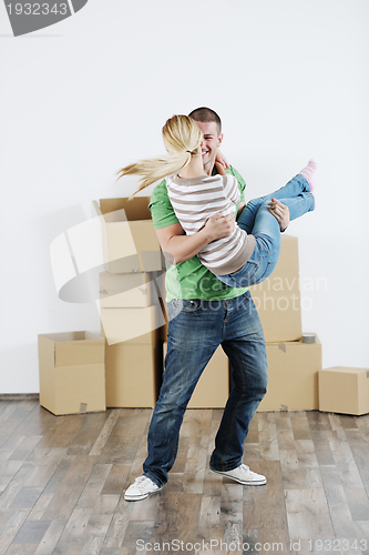 Image of Young couple moving in new house