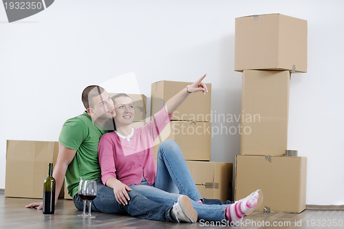 Image of Young couple moving in new house