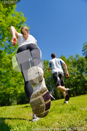 Image of Young couple jogging