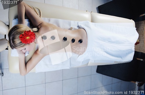 Image of Beautiful young woman in spa