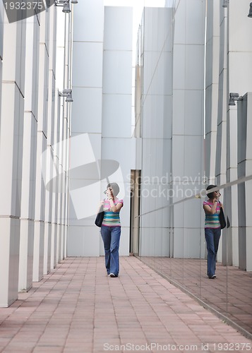 Image of beautiful young woman in the city