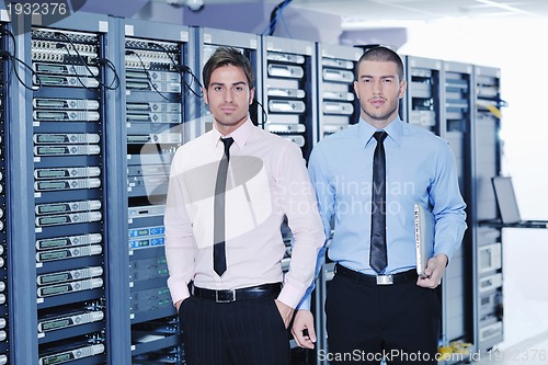 Image of it enineers in network server room