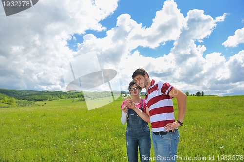 Image of romantic young couple in love together outdoor