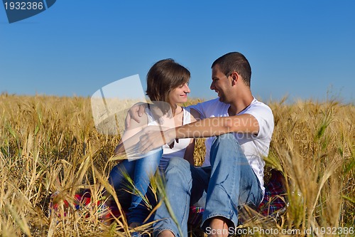 Image of happy couple in wheat field