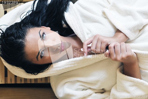 Image of Young woman take a steam bath