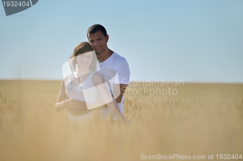 Image of happy couple in wheat field