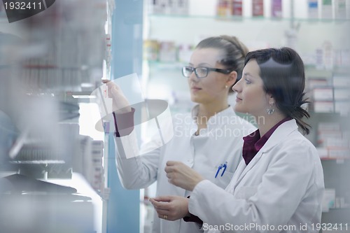 Image of team of pharmacist chemist woman  in pharmacy drugstore