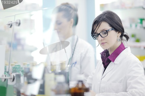 Image of team of pharmacist chemist woman  in pharmacy drugstore