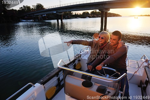 Image of couple in love  have romantic time on boat