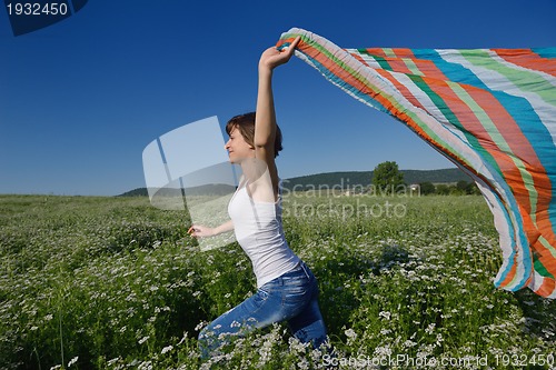 Image of young woman in wheat field at summer