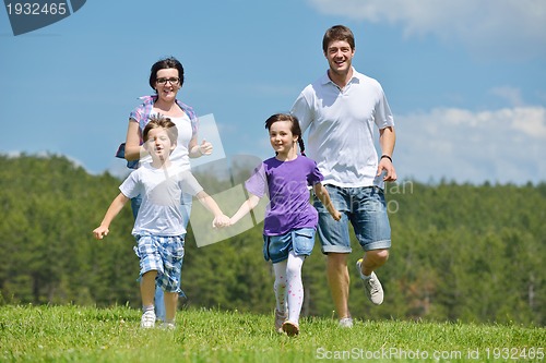 Image of happy young family have fun outdoors