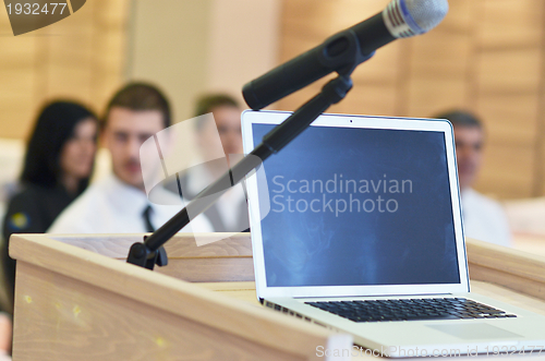 Image of laptop on conference speech podium