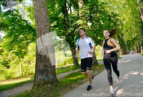 Image of Young couple jogging