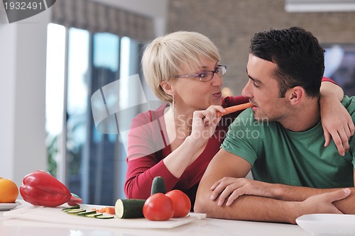 Image of young couple have fun in modern kitchen