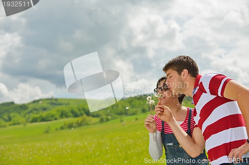 Image of Portrait of romantic young couple smiling together outdoor