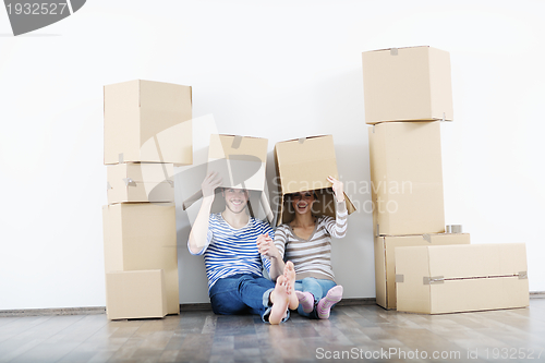 Image of Young couple moving in new house