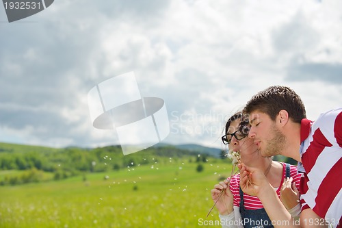 Image of romantic young couple in love together outdoor