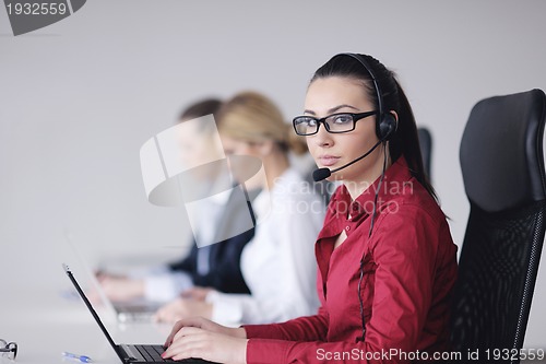 Image of business woman group with headphones