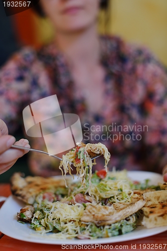 Image of woman eat salad