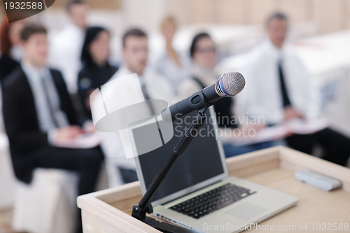 Image of laptop on conference speech podium